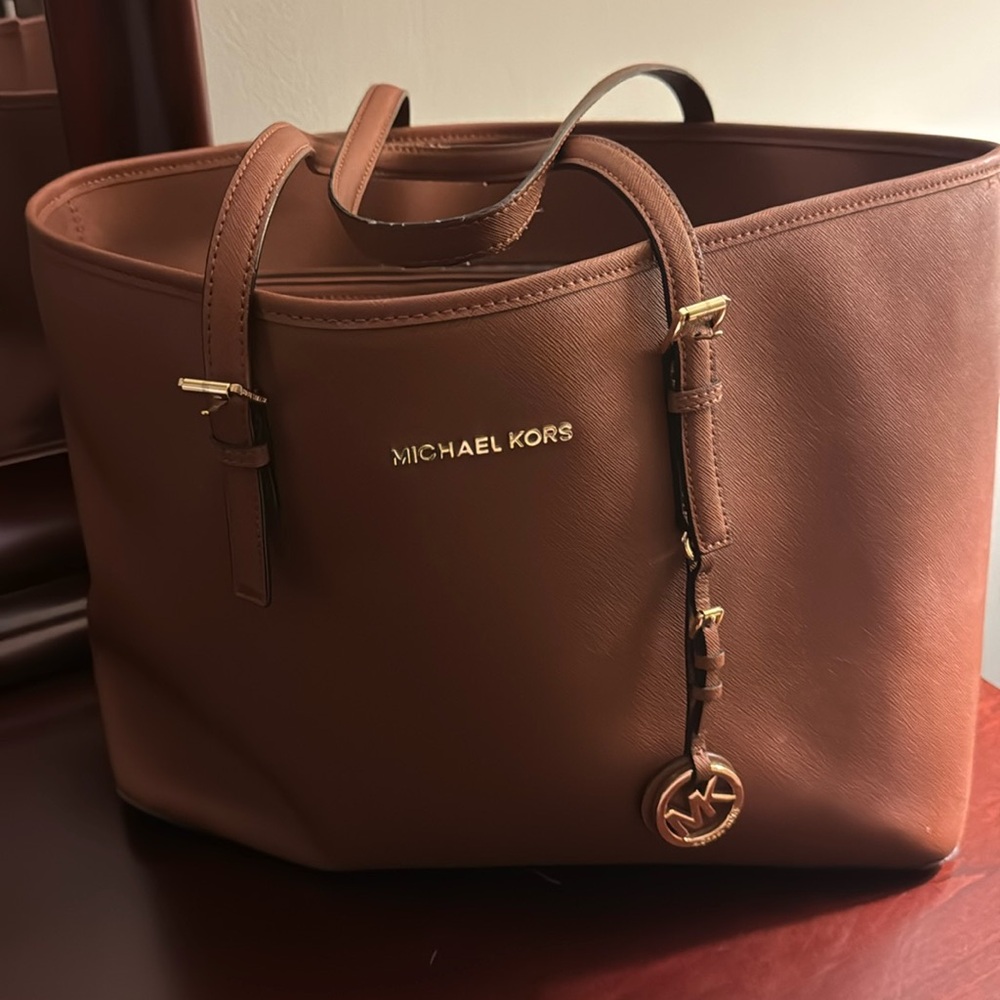 Michael Kors laptop bag. Brown color.